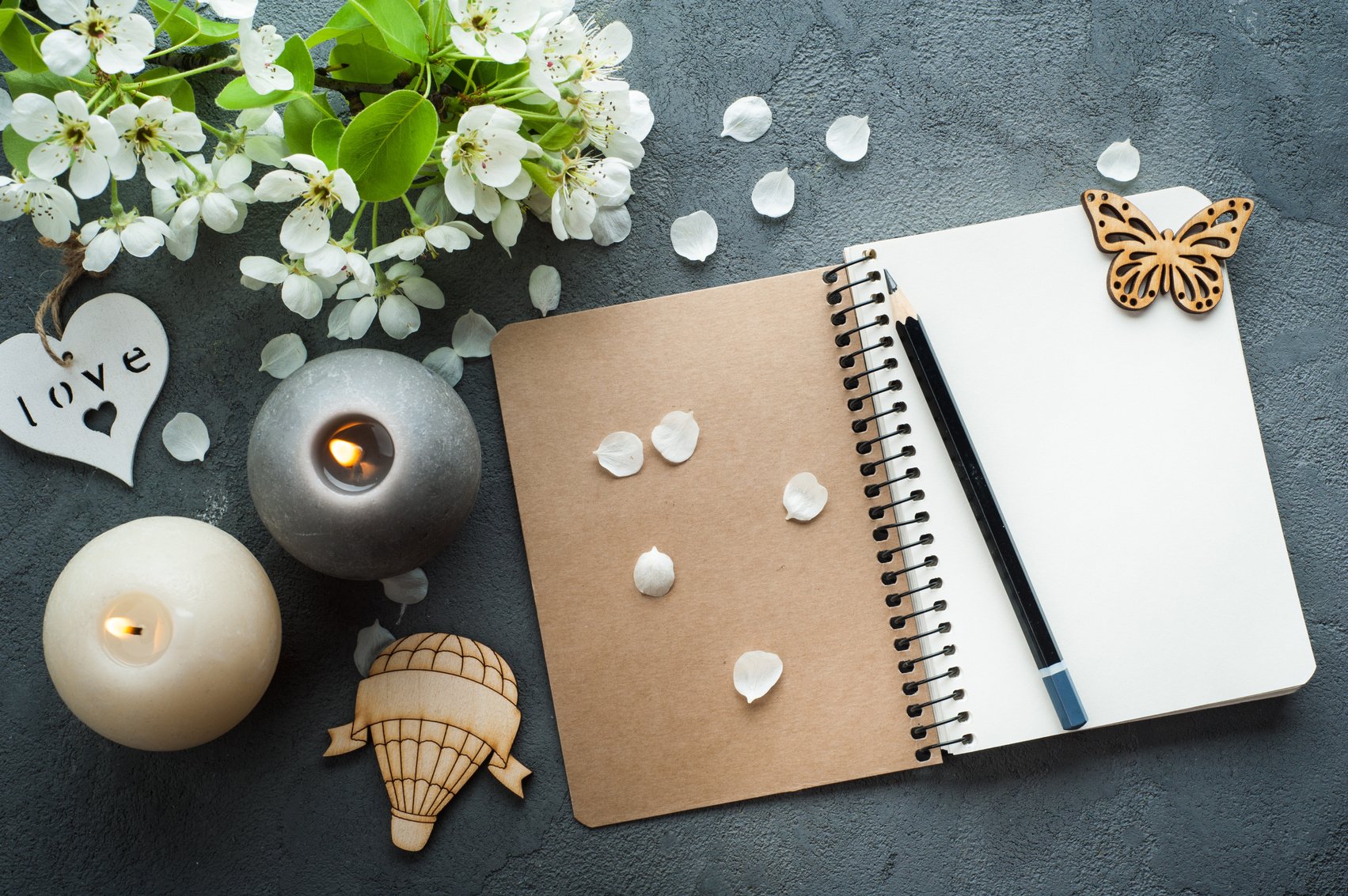 Open Blank Journal with Candles and Flowers